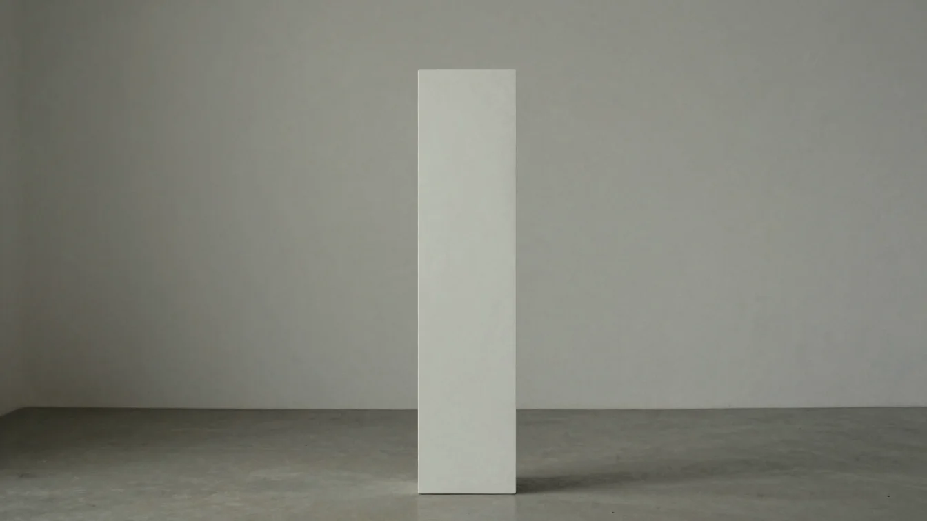 Conceptual editorial photograph of a single, stark white sculptur